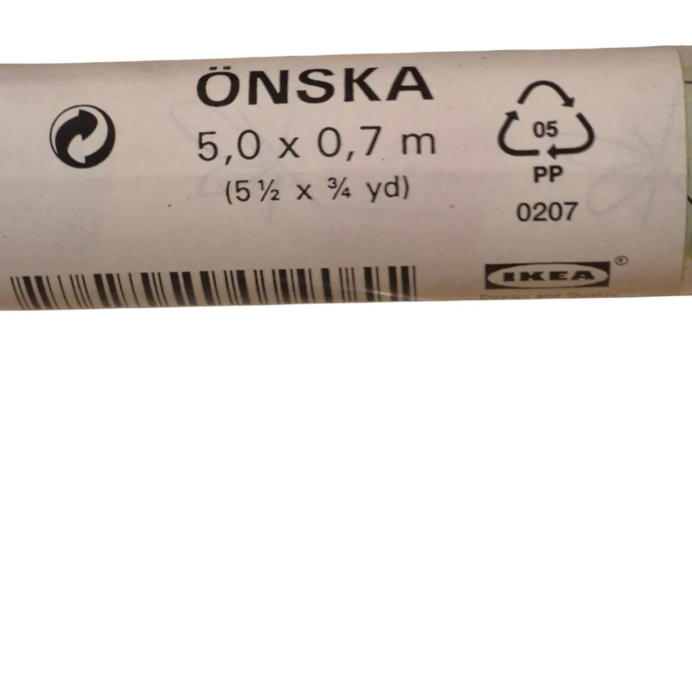 ÖNSKA wrapping paper from IKEA.  In a multi colored with white background in a c
